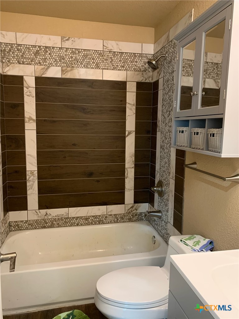 952 Fannin Loop Temple, TX 76501 - Photo 12 of 17 a bathroom with a sink toilet and shower