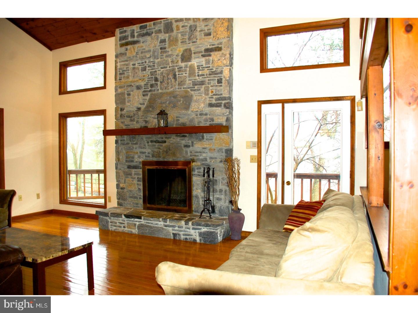163 Mail Rte Road Sinking Spring, PA 19608 - Photo 15 of 25 a living room with furniture a window and a fireplace