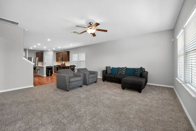 a living room with furniture and a window