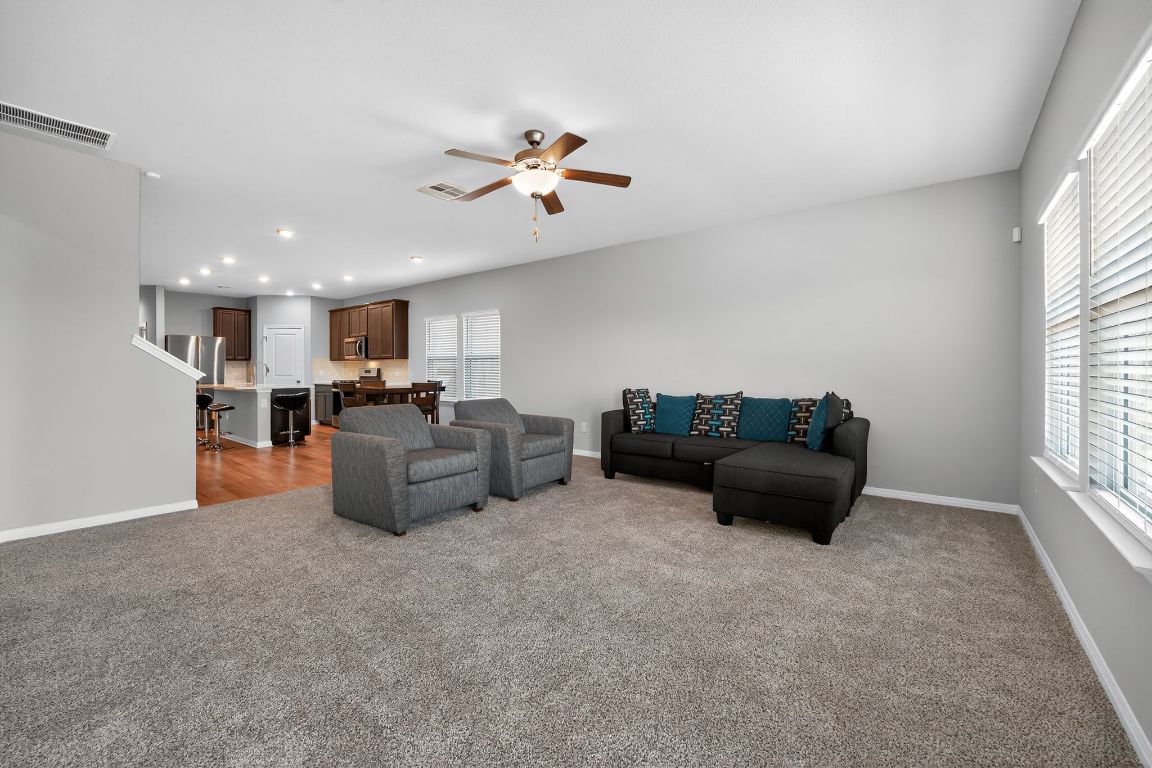 17801 Prairie Land Way Manor, TX 78653 - Photo 11 of 31 a living room with furniture and a window