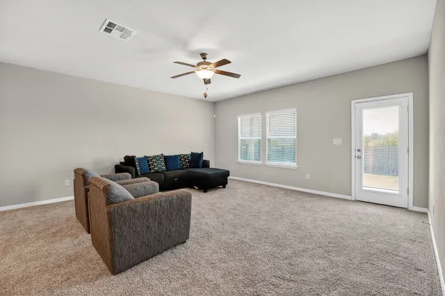 a living room with furniture and window