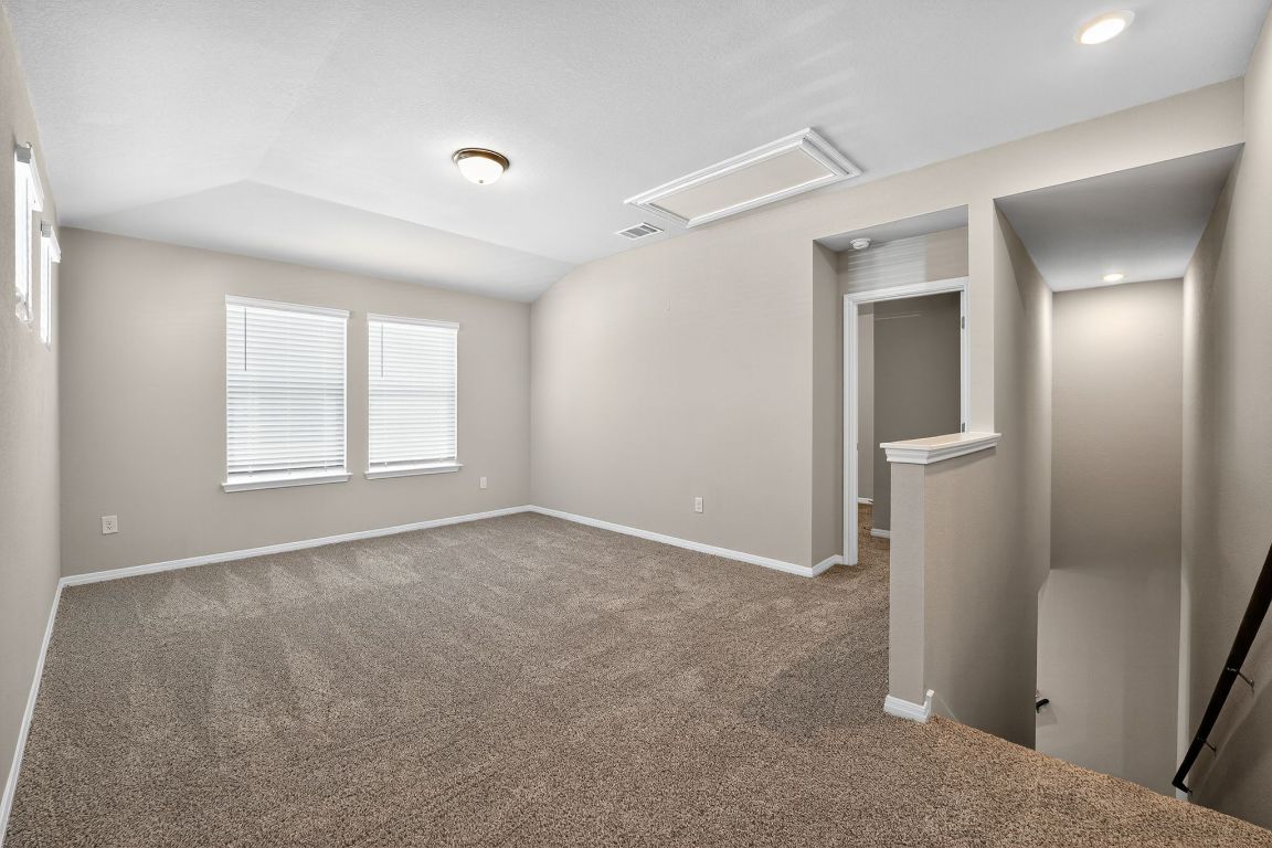 17801 Prairie Land Way Manor, TX 78653 - Photo 19 of 31 a view of an empty room with a window