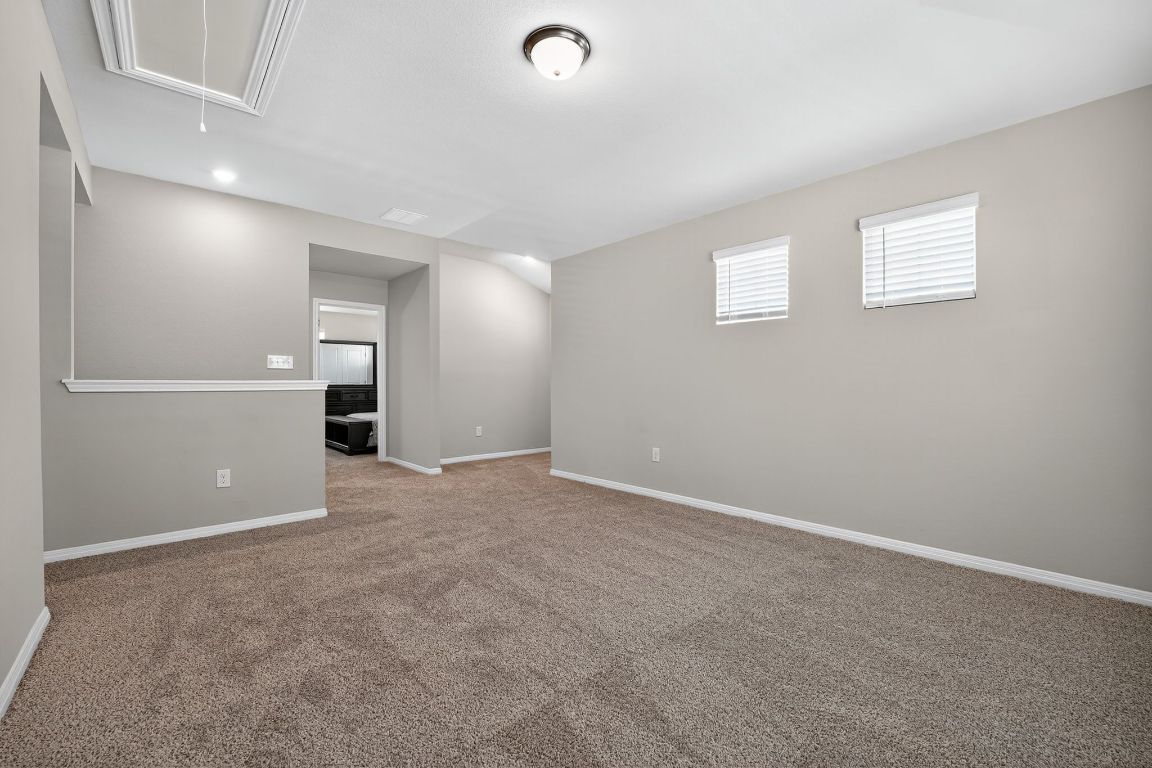 17801 Prairie Land Way Manor, TX 78653 - Photo 20 of 31 an empty room with closet and windows
