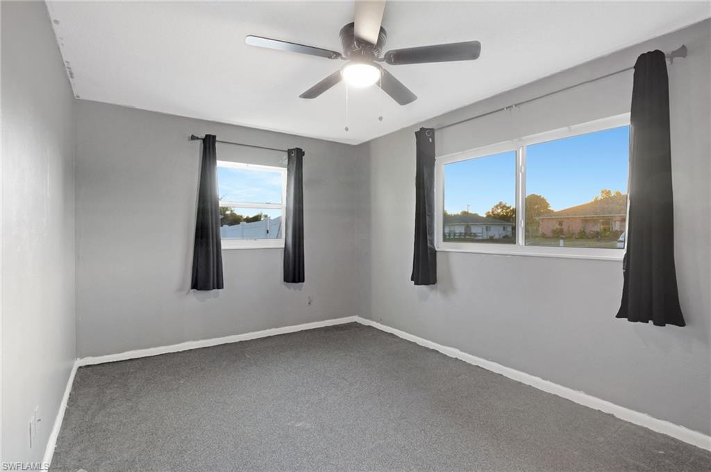 14 Illinois Road Lehigh Acres, FL 33936 - Photo 17 of 31 an empty room with a window