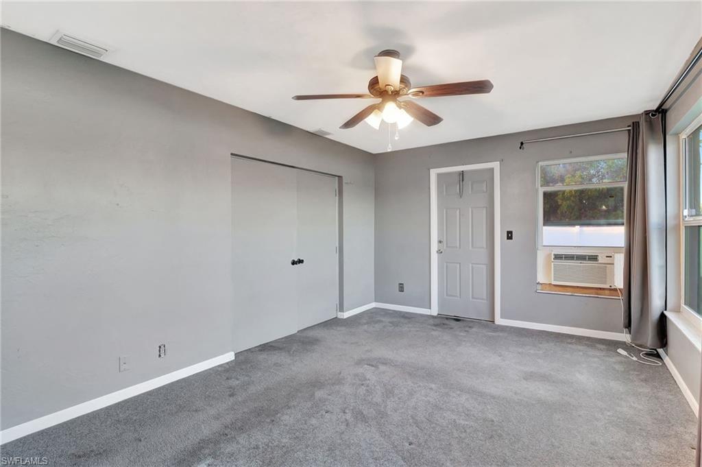 14 Illinois Road Lehigh Acres, FL 33936 - Photo 26 of 31 a view of an empty room with a window