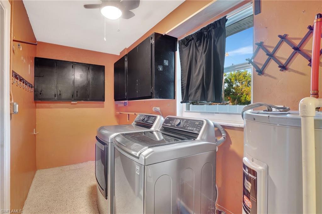 14 Illinois Road Lehigh Acres, FL 33936 - Photo 8 of 31 a bathroom with a sink and a mirror