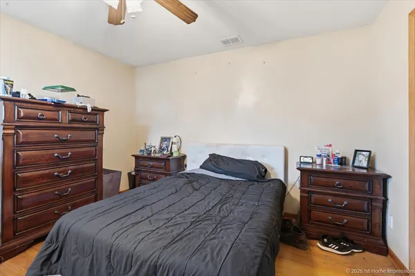 a bedroom with a bed and a dresser