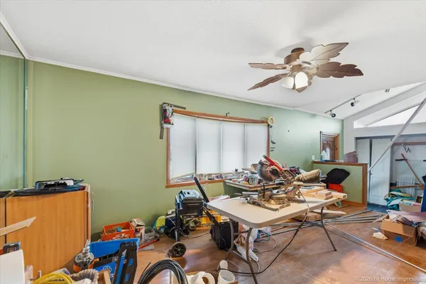 a living room with furniture a rug and a window