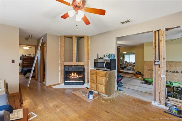 a view of a livingroom with furniture and a flat screen tv