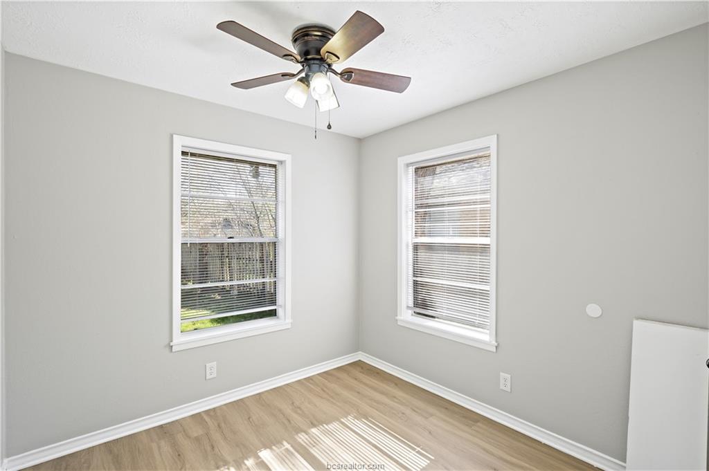 1907 Orman Street Bryan, TX 77801 - Photo 13 of 20 a view of a livingroom with a window and a ceiling fan
