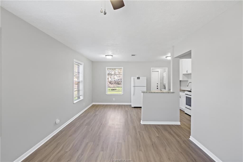1907 Orman Street Bryan, TX 77801 - Photo 5 of 20 an empty room with wooden floor and windows