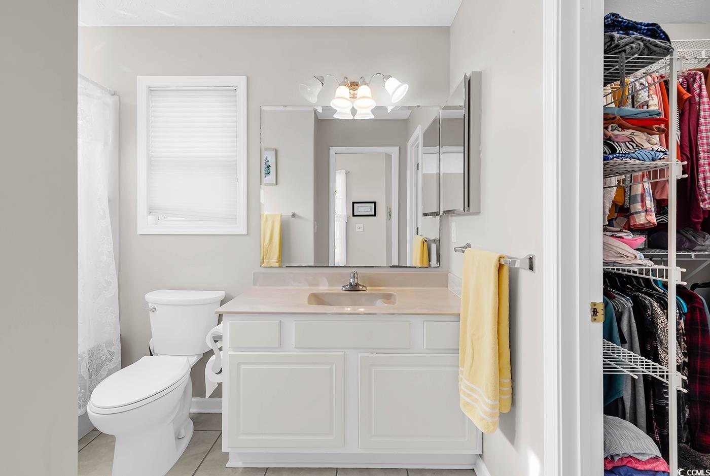 653 Pamlico Court Myrtle Beach, SC 29588 - Photo 19 of 39 Full bath with a shower Tub, vanity, and light tile patterned floors