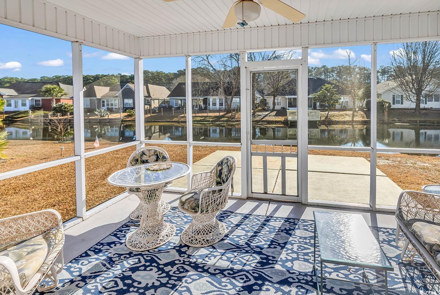 653 Pamlico Court Myrtle Beach, SC 29588 - Photo 31 of 39 Water view, plenty of natural light, a water view, and a ceiling fan