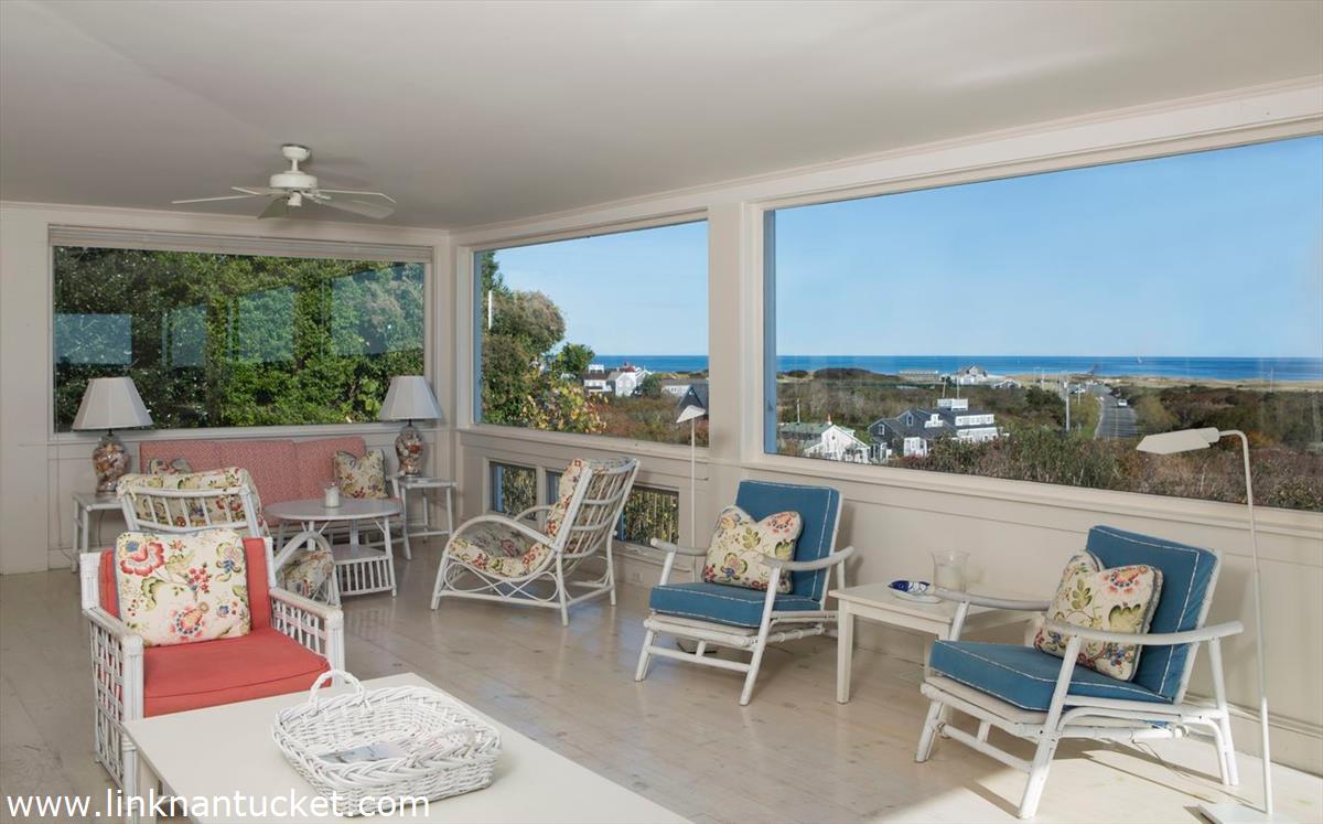 47 Cliff Road Nantucket, MA 02554 - Photo 16 of 22 a living room with furniture and a large window