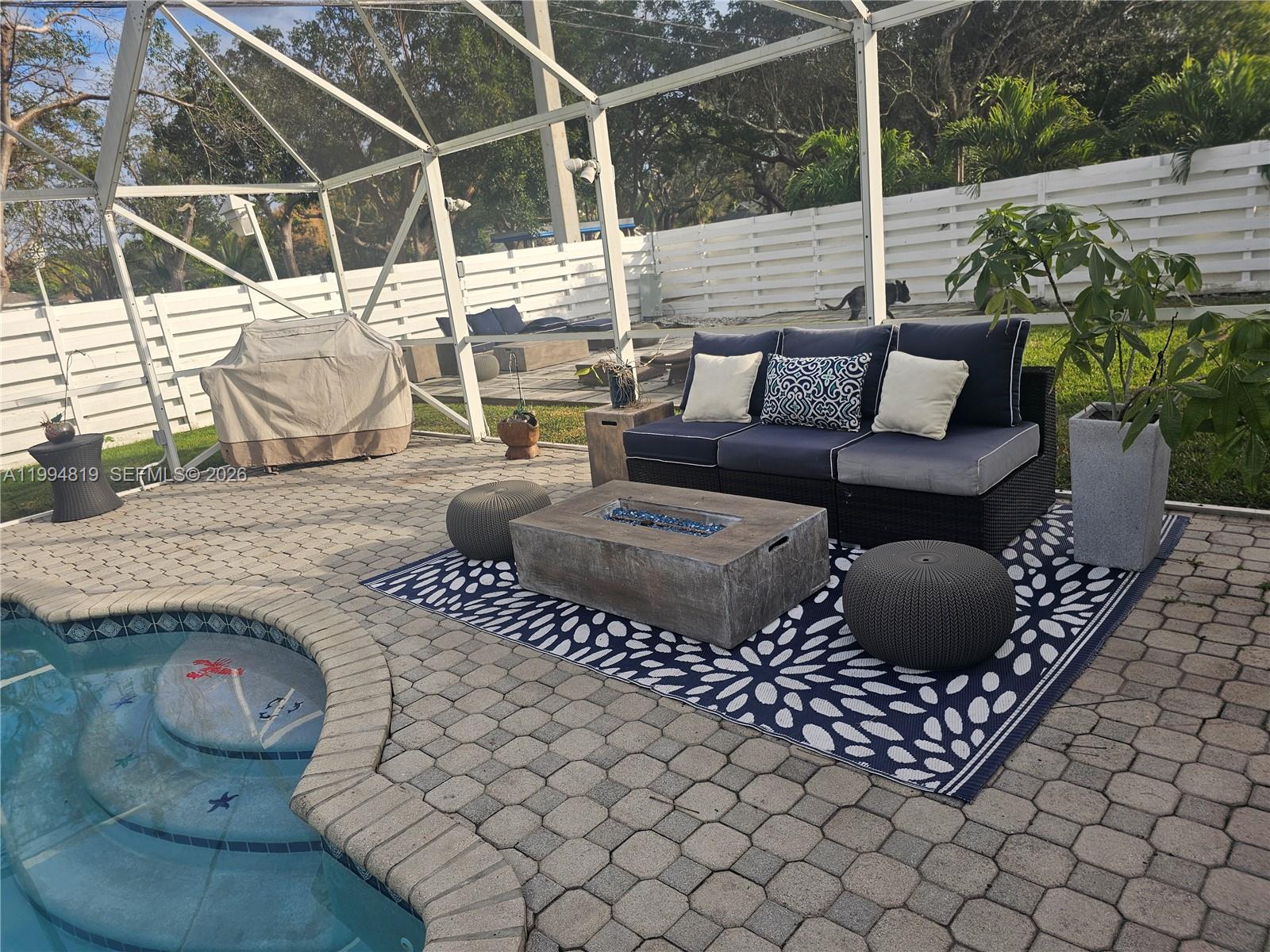14461 Southwest 152nd Court Miami, FL 33196 - Photo 13 of 14 a outdoor living space with furniture