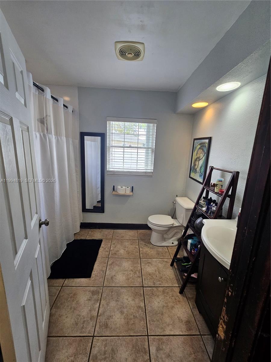 14461 Southwest 152nd Court Miami, FL 33196 - Photo 6 of 14 a room with furniture and a window