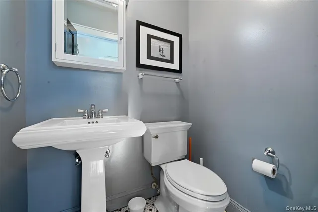 a bedroom with a bed dresser and a window