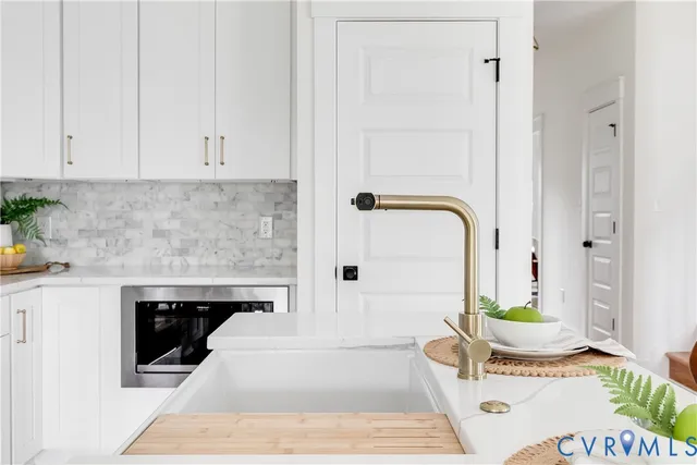 a bathroom with a tub and sink