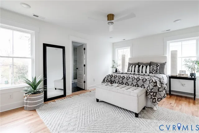 a bedroom with a large bed and a window