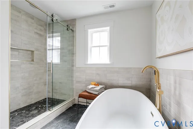 a bathroom with a sink and shower