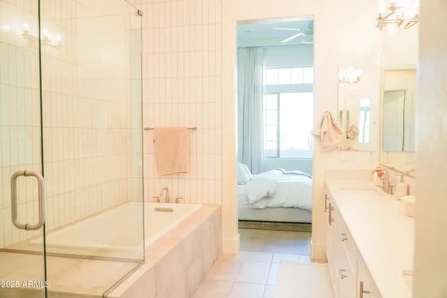 a spacious bathroom with a bathtub sink and toilet