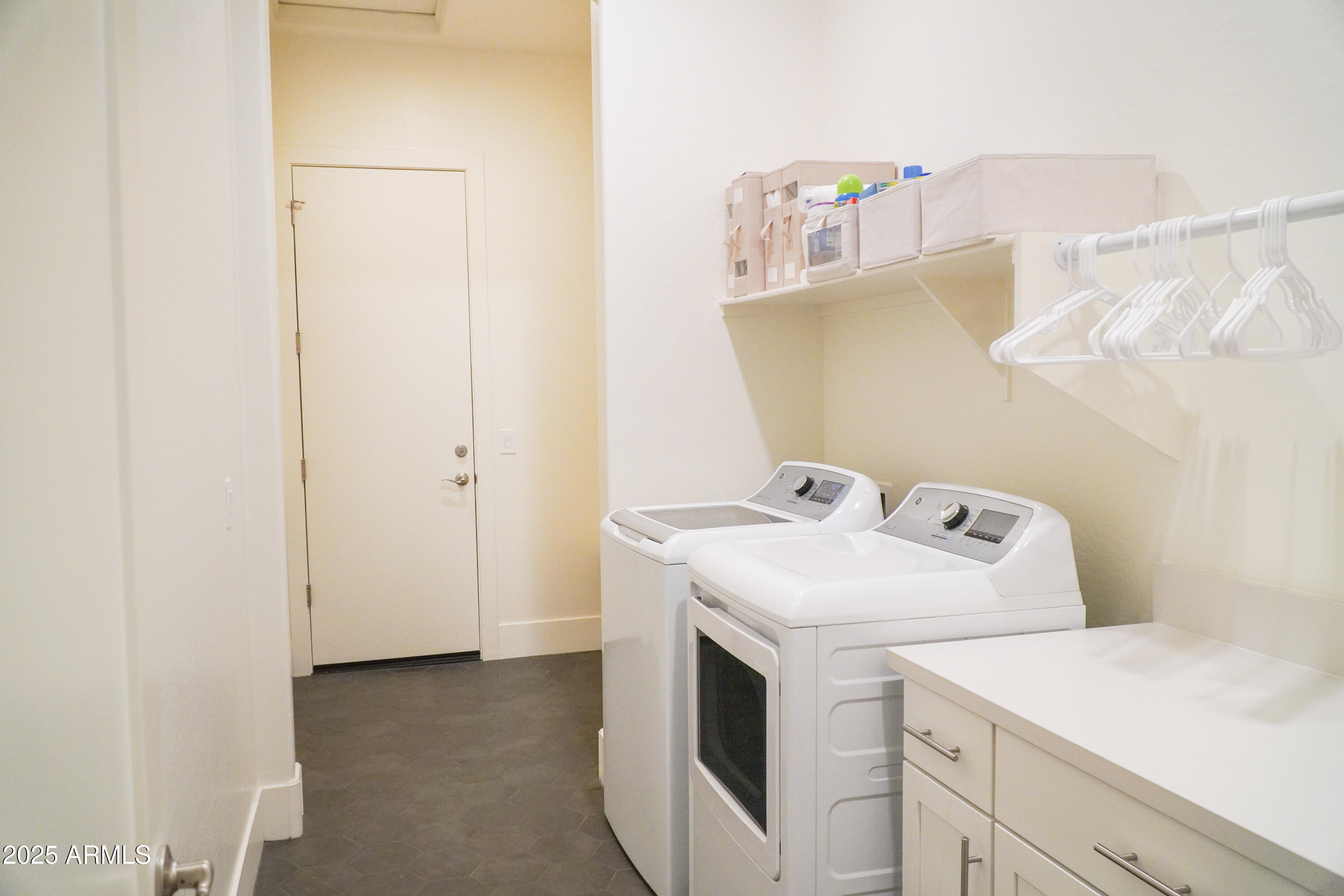 38500 North School House Road, Unit 40 Cave Creek, AZ 85331 - Photo 14 of 15 a utility room with dryer and washer