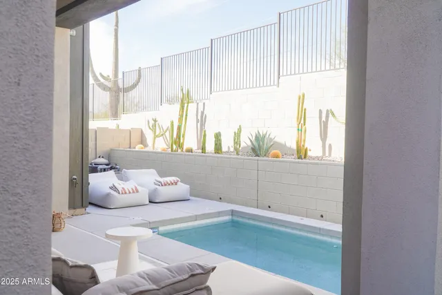 a room with wooden floor and windows