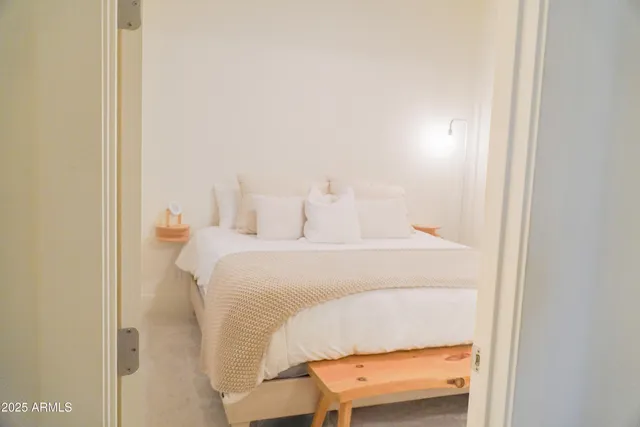 a bedroom with a bed and a cabinets