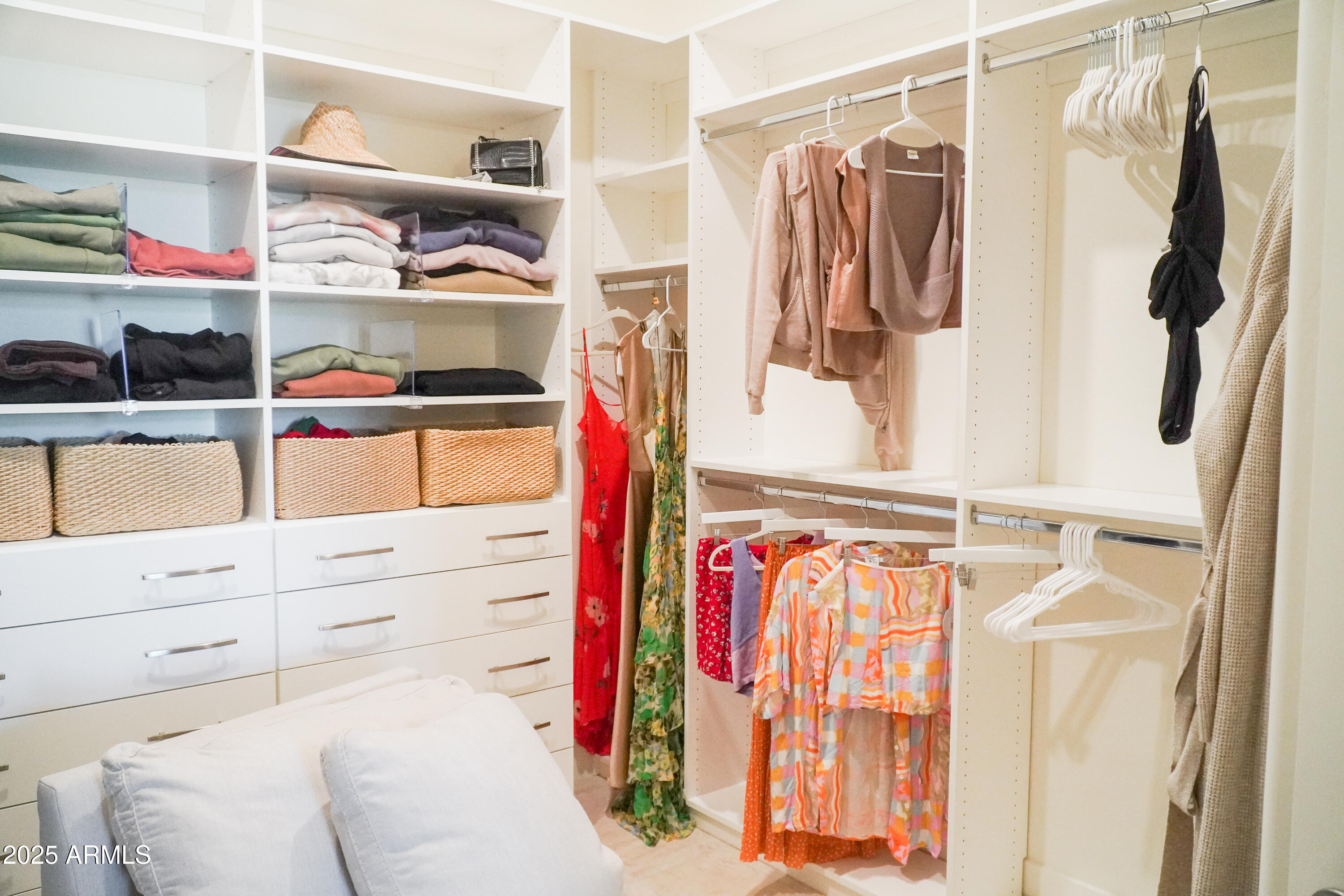 38500 North School House Road, Unit 40 Cave Creek, AZ 85331 - Photo 7 of 15 a view of walk in closet with clothes and shoes
