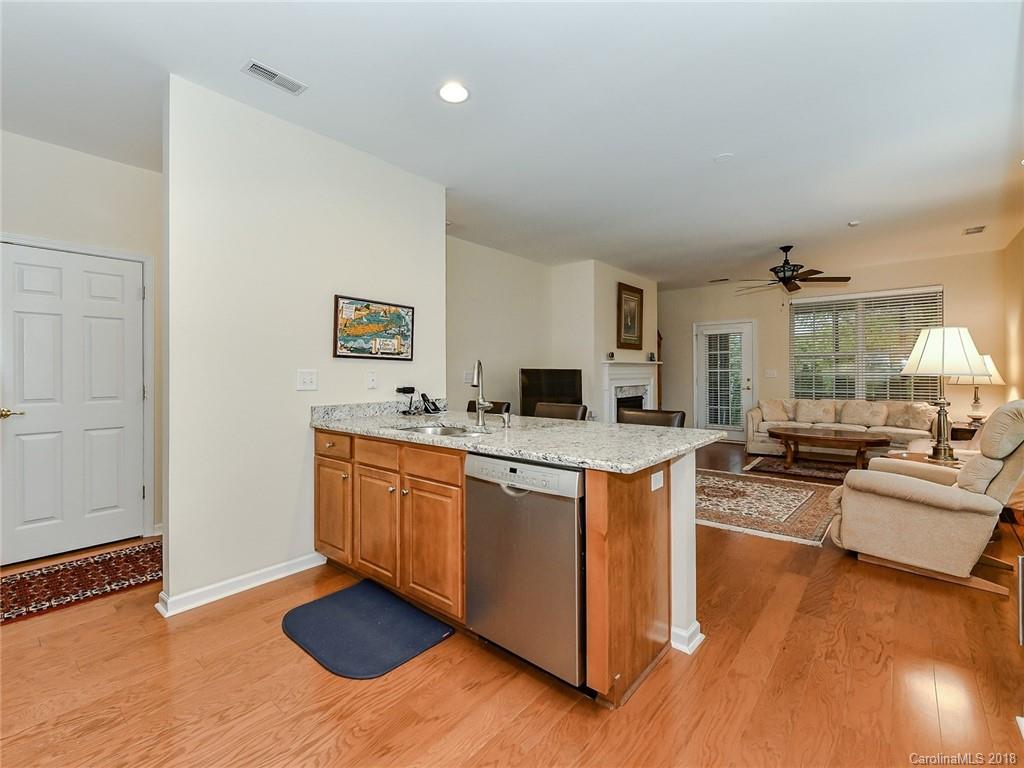389 Garnet Court Fort Mill, SC 29708 - Photo 15 of 29 a large kitchen with stainless steel appliances granite countertop a stove and a sink