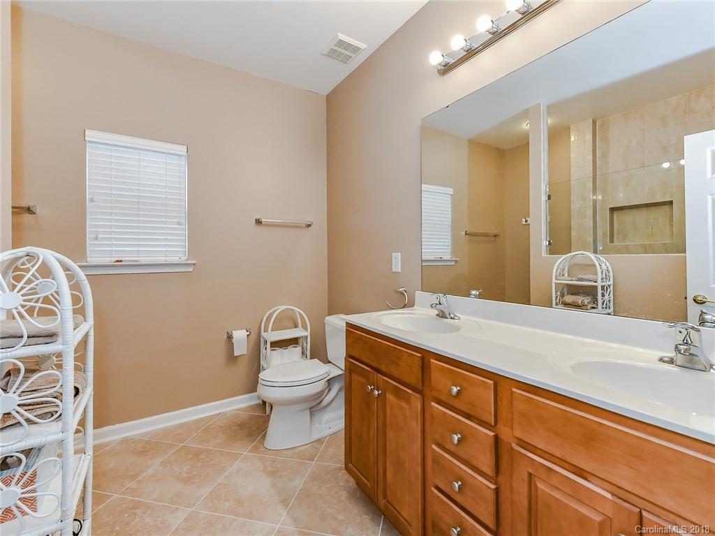 389 Garnet Court Fort Mill, SC 29708 - Photo 18 of 29 a bathroom with a sink toilet and mirror