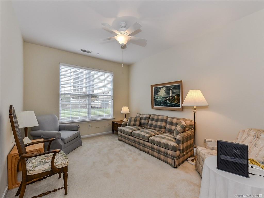 389 Garnet Court Fort Mill, SC 29708 - Photo 21 of 29 a spacious bedroom with a bed and a couch