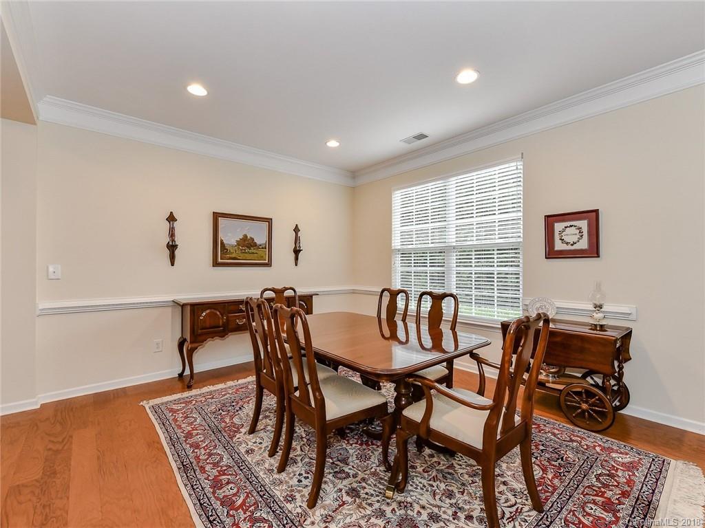 389 Garnet Court Fort Mill, SC 29708 - Photo 8 of 29 a view of a dining room with furniture