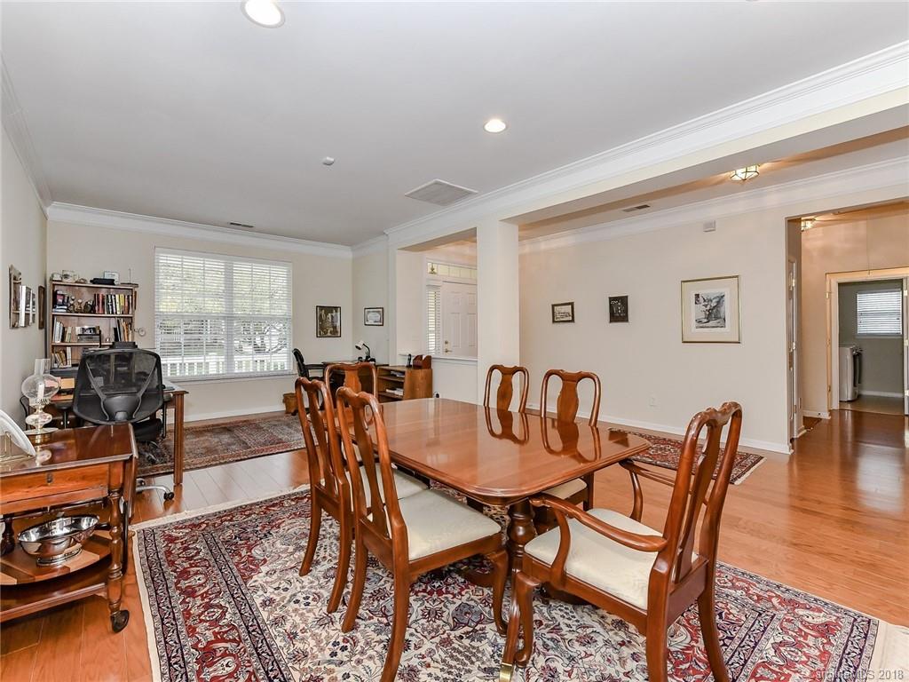 389 Garnet Court Fort Mill, SC 29708 - Photo 9 of 29 a view of a dining room with furniture window and wooden floor