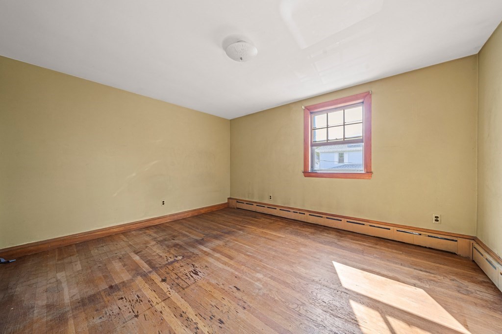 16 Magdala Street Boston, MA 02124 - Photo 12 of 22 an empty room with a window