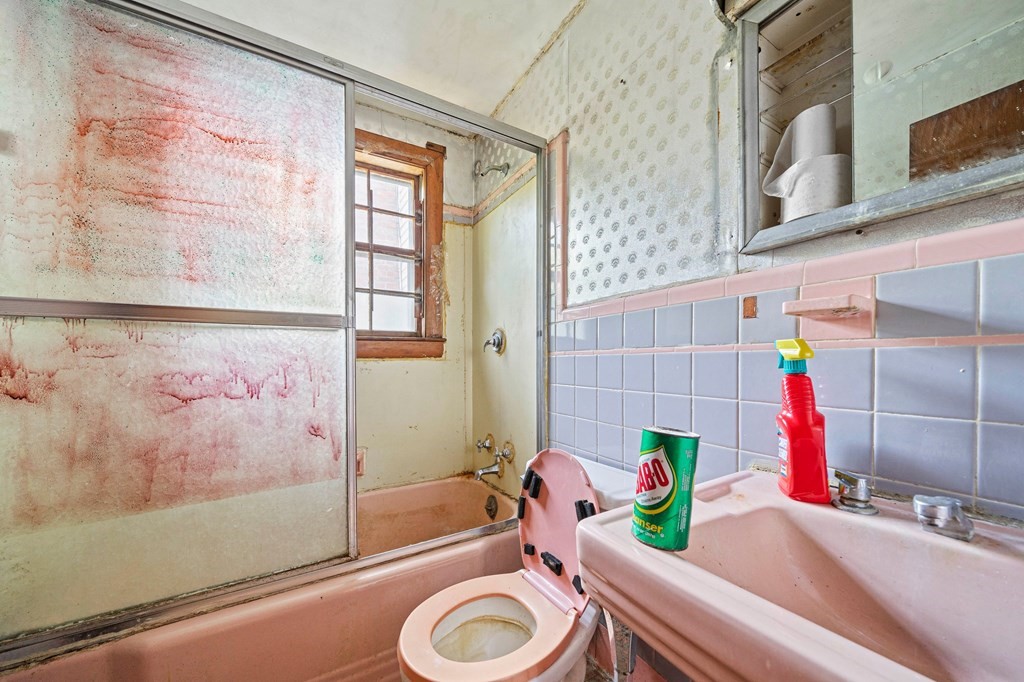 16 Magdala Street Boston, MA 02124 - Photo 16 of 22 a bathroom with a sink a toilet and shower