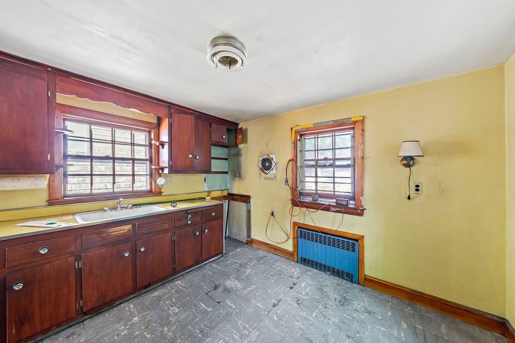 16 Magdala Street Boston, MA 02124 - Photo 3 of 22 a large bathroom with a tub sink and mirror