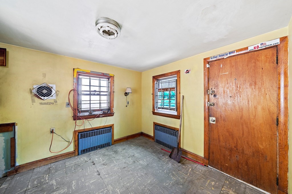 16 Magdala Street Boston, MA 02124 - Photo 4 of 22 wooden floor and windows in a room next to a window