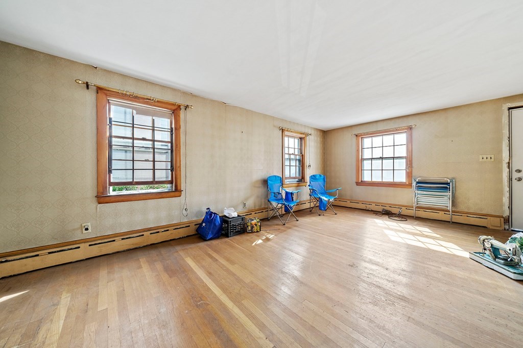 16 Magdala Street Boston, MA 02124 - Photo 7 of 22 a view of a room with gym equipment and windows