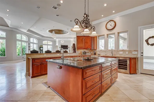 a kitchen with stainless steel appliances wooden cabinets and a sink
