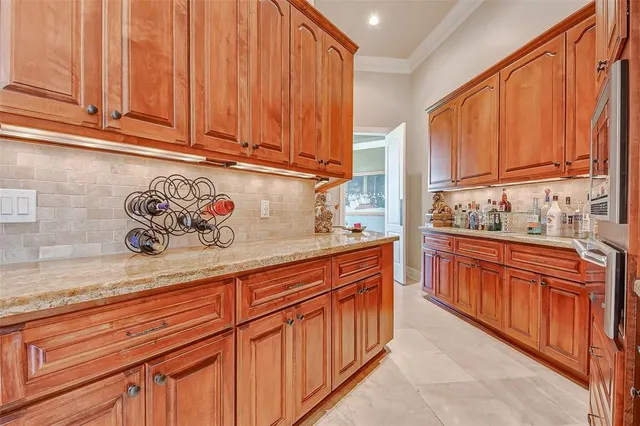 a bathroom with a granite countertop sink a mirror and a shower