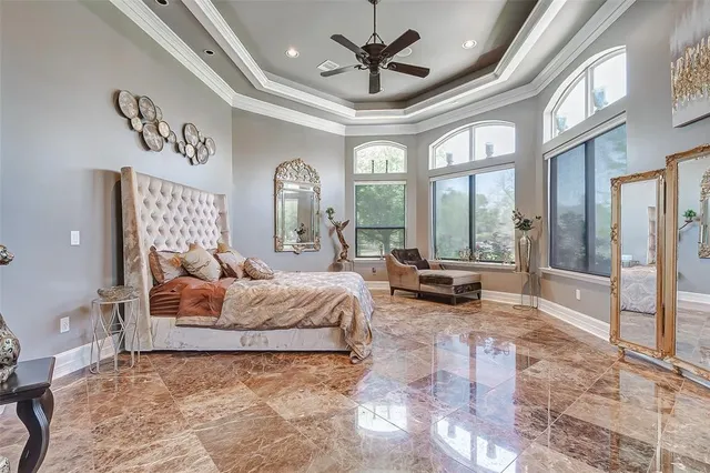 a living room with furniture a fireplace and a large mirror