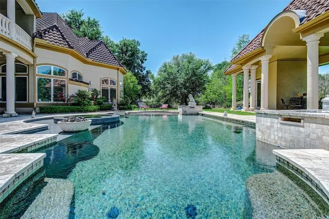 a view of pool with outdoor seating
