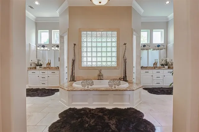 a view of kitchen with microwave and cabinets