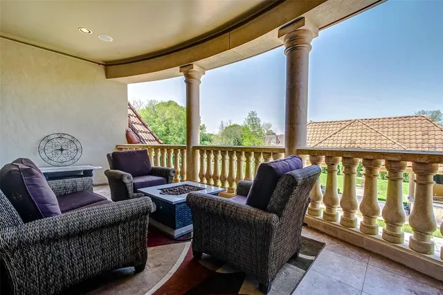 a projector room with furniture and a chandelier