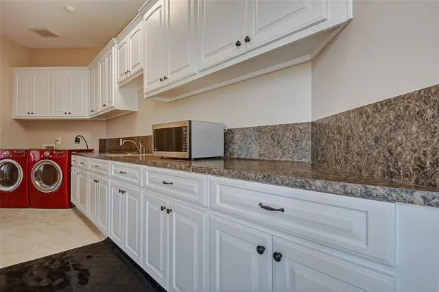 a view of a hallway with furniture and a window