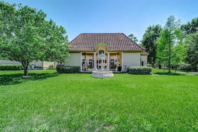 a view of a swimming pool with a patio