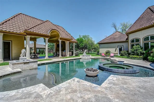a front view of a house with a yard table and chairs