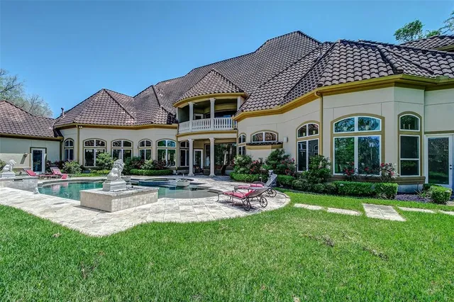 a view of a porch with furniture and garden