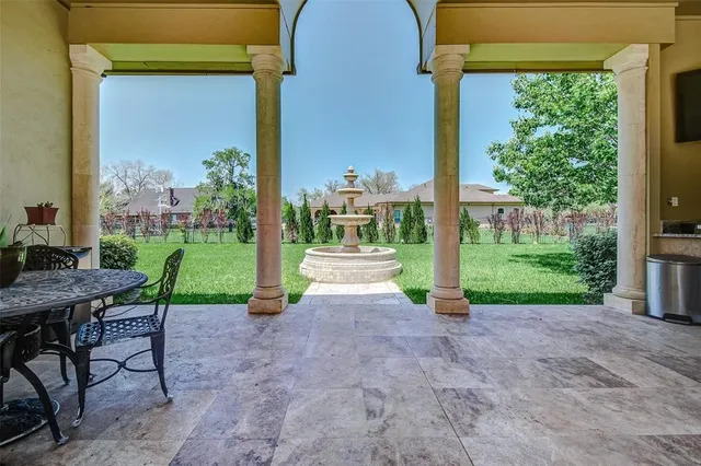 a view of a house with a porch and furniture